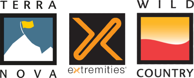 Three outdoor brand logos side by side: left, the Terra Nova logo showing a stylised white mountain on a blue square topped by a small yellow flag with TERRA NOVA text; centre, the Extremities logo with an orange stylised 'X' on a black square and 'extremities' text beneath; right, the Wild Country by Terra Nova logo showing a square with a yellow-to-red gradient wave and 'WILD COUNTRY' with 'by Terra Nova' text.