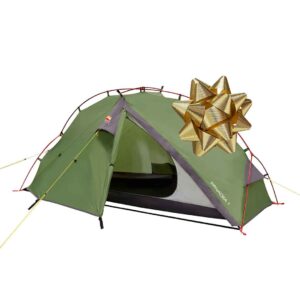 Green two-person dome camping tent with red poles and yellow guy lines, front door partly open to show a dark interior, and a large metallic gold gift bow placed on the upper right of the tent.