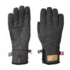 Pair of dark grey speckled knit winter gloves — one showing a black synthetic-leather reinforced palm with a touchscreen-capable fingertip and XDRY cuff tag, the other showing the back with a small zip pocket and a tan brand patch.