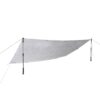 Light grey rectangular camping tarp stretched into a low angled shelter, tensioned by two adjustable trekking poles with guy lines and stake points against a white background.