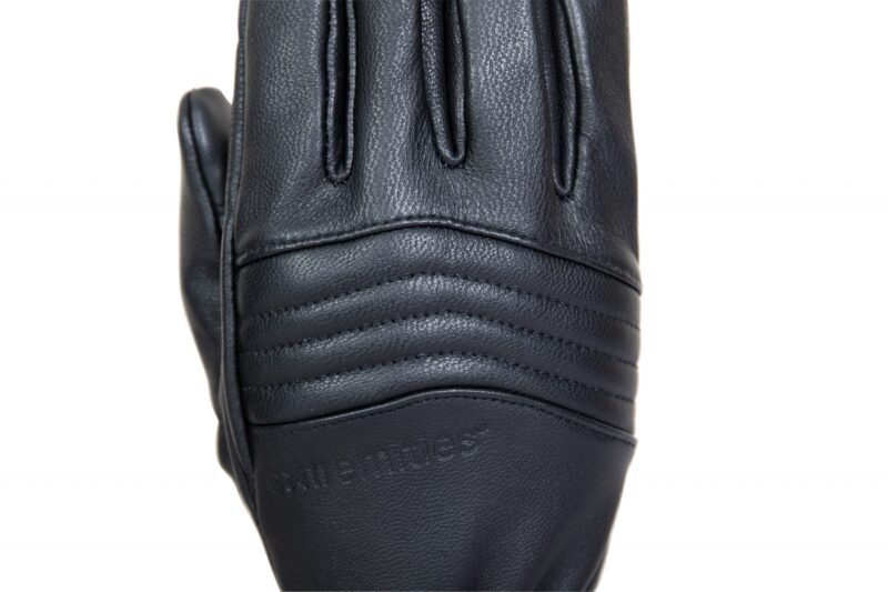Close-up of a black leather glove top with padded horizontal ribbed stitching across the knuckles and faint embossed branding, shown on a white background.