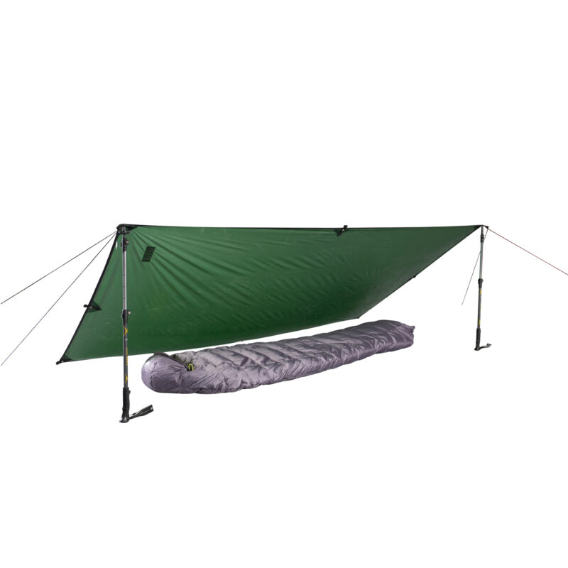 Green tarp pitched as an A-frame using two trekking poles and guy lines, sheltering a grey mummy-style sleeping bag on a white background.