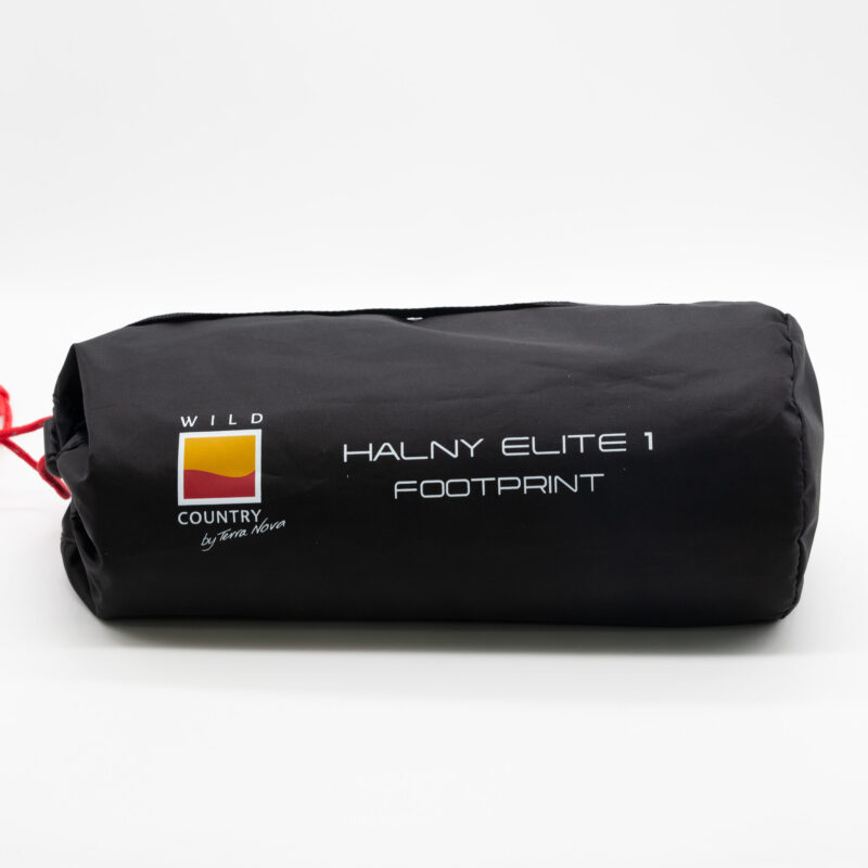 Black cylindrical storage bag with a red drawcord, Wild Country by Terra Nova logo and white text reading 'HALNY ELITE 1 FOOTPRINT'.