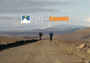 Two runners on a rugged dirt path in a scenic landscape, featuring mountains in the background, showcasing a collaboration between Terra Nova and GNR.