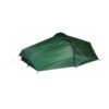 Low-profile dark green tunnel tent with black trim and yellow guy-lines staked out, shown on a white background.