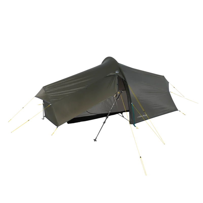 Dark olive-green tunnel-style backpacking tent with an open vestibule revealing an inner mesh sleeping area, staked out with yellow guy lines and propped at the entrance by a trekking pole, shown against a black background.