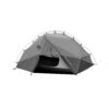 Grey dome-style two-person camping tent with arched pole frame and rainfly, front door partly open revealing inner mesh and black groundsheet, with guy lines staked out.