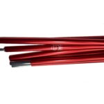 Several red anodised aluminium tent poles with silver connecting ends arranged horizontally on a white background.