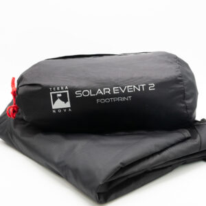 Black roll-up bag and folded footprint fabric printed with the Terra Nova logo and the text “SOLAR EVENT 2 FOOTPRINT,” with a red drawcord, on a white background