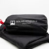 Black cylindrical stuff sack with a white mountain-flag logo and the text 'TERRA NOVA SOLAR HORIZON 2 FOOTPRINT', featuring a red drawcord and resting on folded black fabric against a white background.