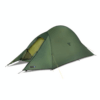 Green two-person dome backpacking tent with an extended vestibule partially open to reveal a yellow inner mesh door, staked and guyed out on a plain white background