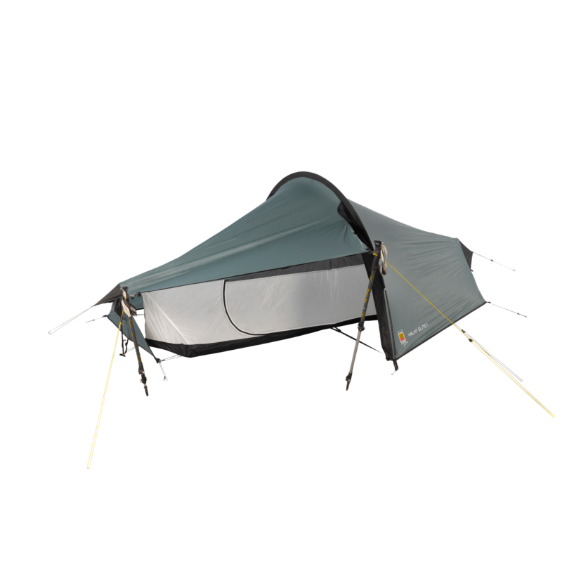 Low-profile single-person tunnel tent with a teal-grey rainfly and light-grey mesh inner, propped up by trekking poles and yellow guy lines, showing a black bathtub floor and a D-shaped side door.
