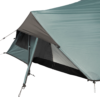 Light teal tent rainfly forming a triangular vestibule, partially unzipped to show a grey inner mesh doorway and black bathtub-style floor, with visible guy lines and adjustment clips.