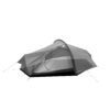 Lightweight two-person tunnel tent with a rounded pole arch, grey rainfly partially opened to reveal a mesh inner door, black bathtub floor and tensioned guy lines staked out.