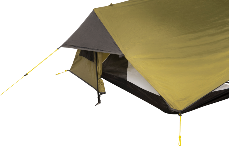 Close-up of the corner of an olive-green and grey backpacking tent with a partially open vestibule revealing a mesh inner door and black bathtub floor, secured with bright yellow guy lines and tensioners.
