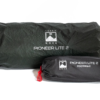 Dark green rolled tent bag labeled Terra Nova Pioneer Lite 2 alongside a smaller black stuff sack marked Pioneer Lite 2 Footprint with a red cord pull.