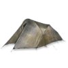 Low-profile two-person ultralight backpacking tent in silvery-grey laminated fabric with a tunnel shape, pegged corners, guy lines and a partially open vestibule door.